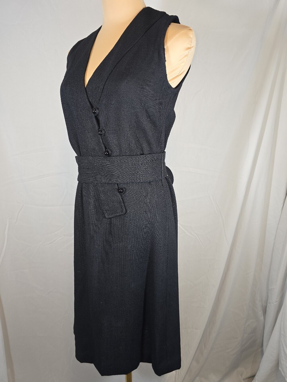 Sleek Black Sleeveless Wrap Dress with Waist Belt